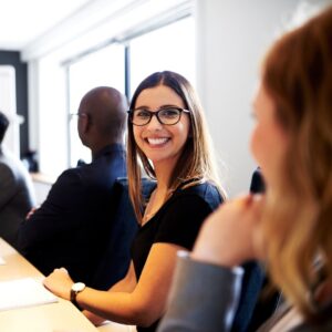 Person smiling in a meeting